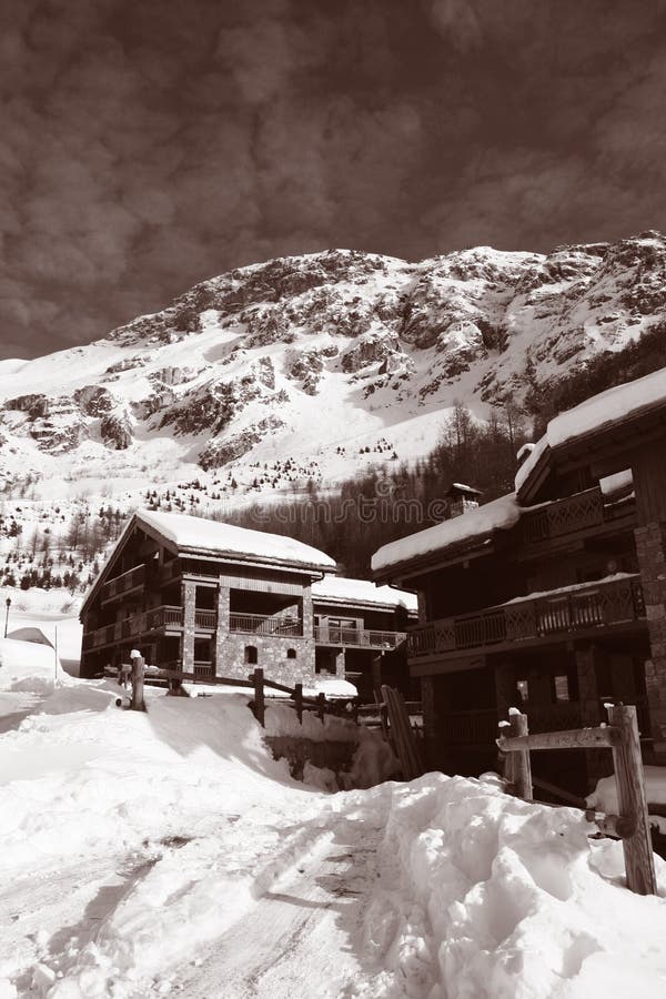 Ski chalets in Val d'Isere, France. Processed in duotone to create sepia style image. Ski chalets in Val d'Isere, France. Processed in duotone to create sepia style image.