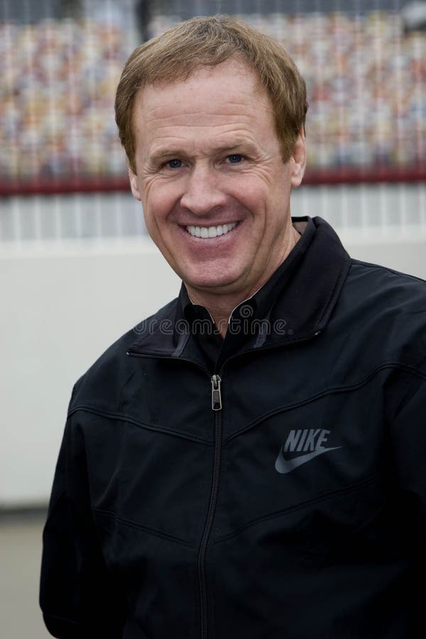 15 October, 2009: Rusty Wallace takes time to smile for the camera in the garage during the rain delay for the running of the NASCAR Banking 500 only from Bank of America. 15 October, 2009: Rusty Wallace takes time to smile for the camera in the garage during the rain delay for the running of the NASCAR Banking 500 only from Bank of America