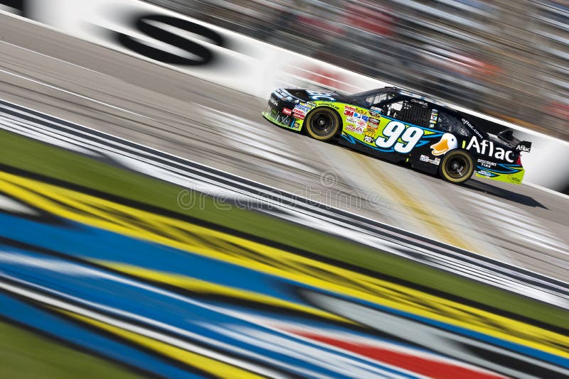 Ft. Worth, TX - 7 November, 2009: Carl Edwards brings his Aflac Ford through the frontstretch during a practice session for the Dickies 500 race in Ft. Worth, Texas. Ft. Worth, TX - 7 November, 2009: Carl Edwards brings his Aflac Ford through the frontstretch during a practice session for the Dickies 500 race in Ft. Worth, Texas.