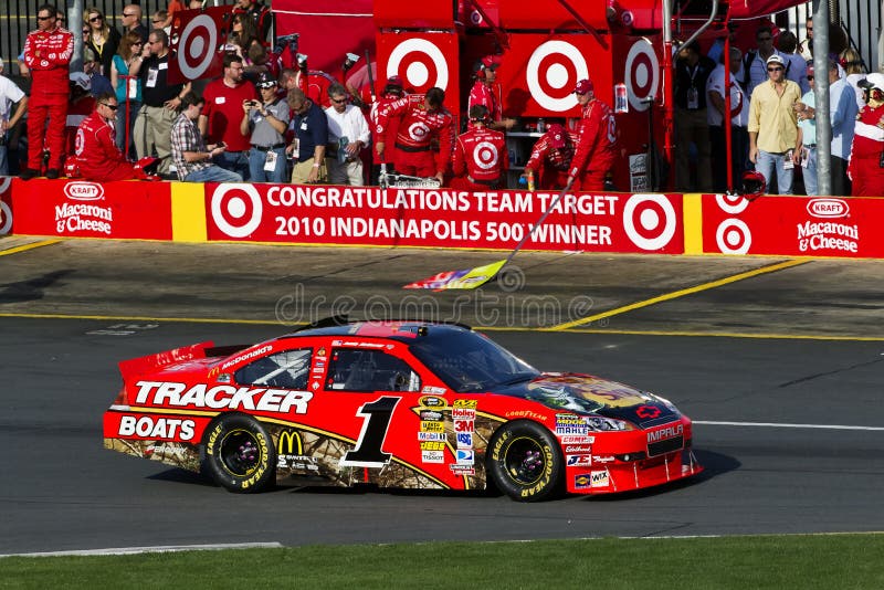 CONCORD, NC - May 30, 2010: Jamie McMurray's Bass Pro Chevrolet sits in front of his teammates pit box as they congradulate Ganassi Racing and Team Target for winning the Indianapolis 500 at the Coca-Cola 600 Race at the Charlotte Motor Speedway in Concord, NC. CONCORD, NC - May 30, 2010: Jamie McMurray's Bass Pro Chevrolet sits in front of his teammates pit box as they congradulate Ganassi Racing and Team Target for winning the Indianapolis 500 at the Coca-Cola 600 Race at the Charlotte Motor Speedway in Concord, NC.
