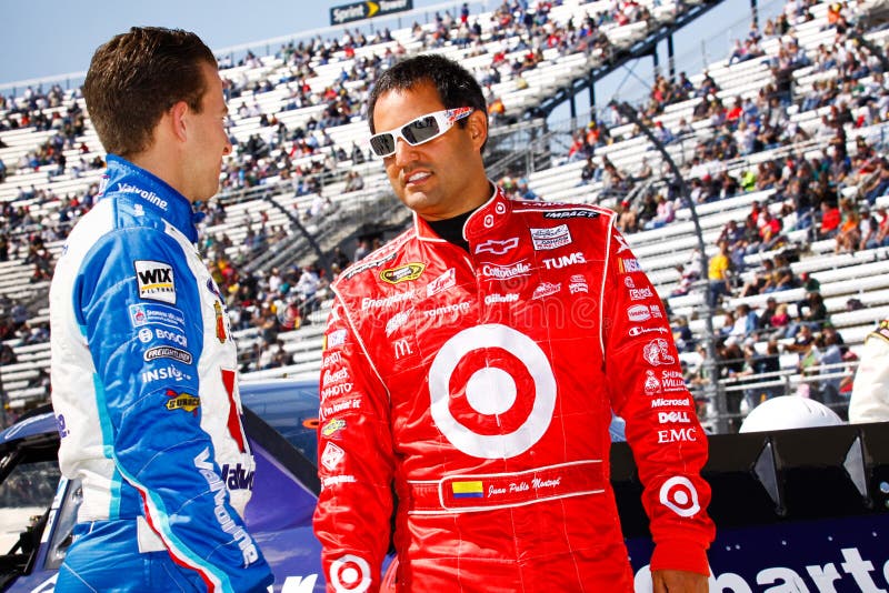 Juan Pable Montoya, driver of the NASCAR #42 Target Chevy, shares a moment with fellow driver A.J. Allmendinger on pit road minutes before the start of the 2010 Goody's 500 NASCAR race at Martinsville Speedway. Juan Pable Montoya, driver of the NASCAR #42 Target Chevy, shares a moment with fellow driver A.J. Allmendinger on pit road minutes before the start of the 2010 Goody's 500 NASCAR race at Martinsville Speedway.