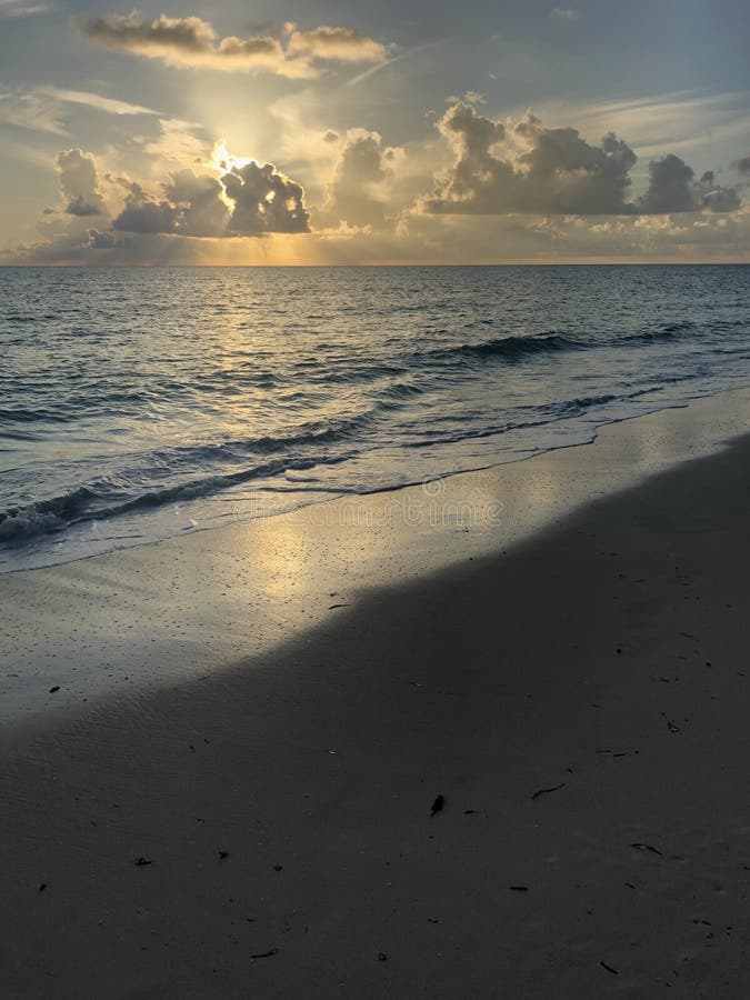 Sun rising over the ocean of zanzibar island, with interesting cloudscapes on the horizon reflecting the light. Sun rising over the ocean of zanzibar island, with interesting cloudscapes on the horizon reflecting the light.