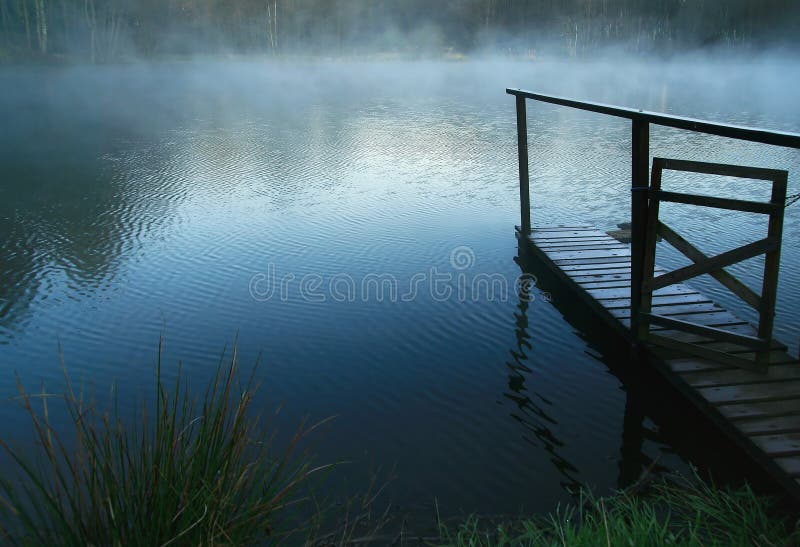 One foggy blue sunrises on pond. One foggy blue sunrises on pond