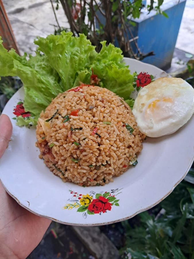 Nasi Goreng or Indonesian Fried Rice Serve with Suuny Side Up and