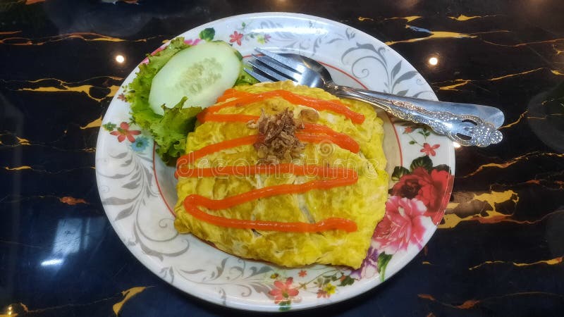 Nasi goreng pattaya or pattaya fried rice. Southest asian dish made from rice and covered with egg or omelette