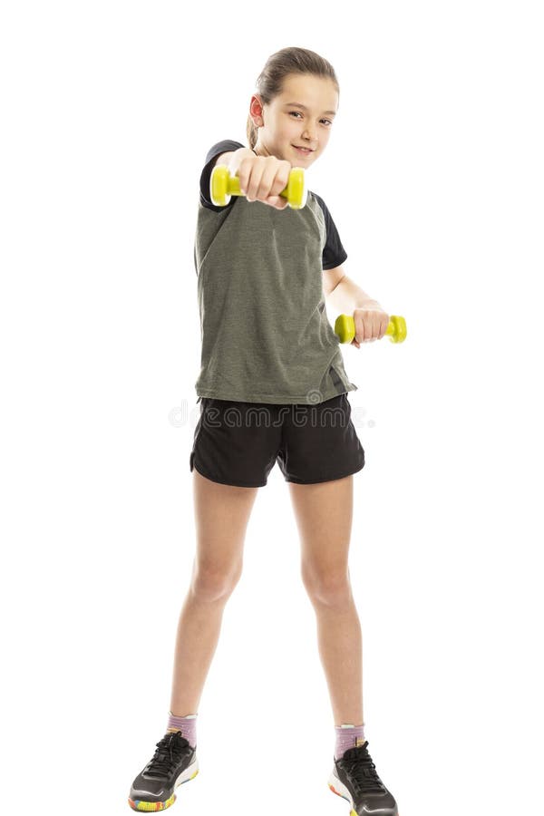 Nastolatek dziewczyna w sportswear z dumbbells pojedynczy bia? e t? o obraz stock