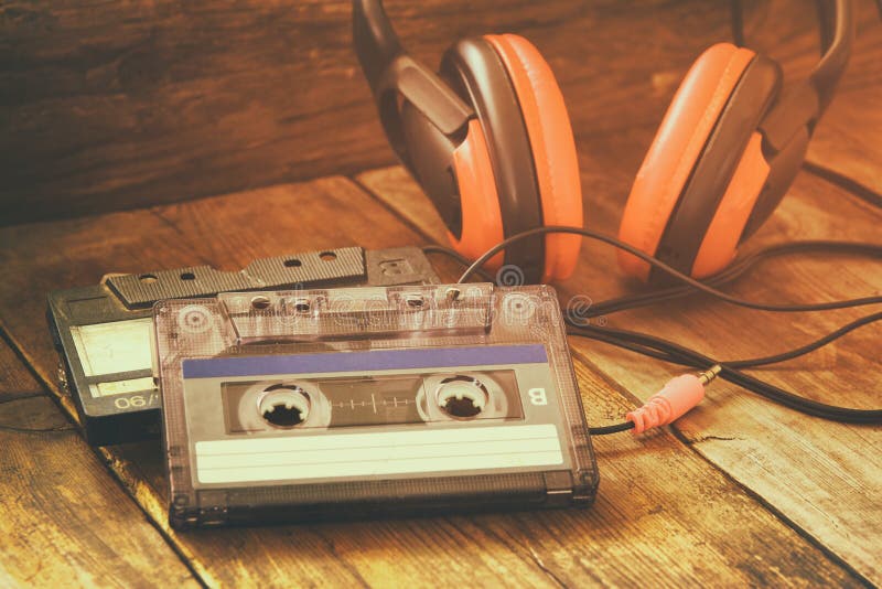 Cassette tape over wooden table. image is instagram style filtered. Cassette tape over wooden table. image is instagram style filtered