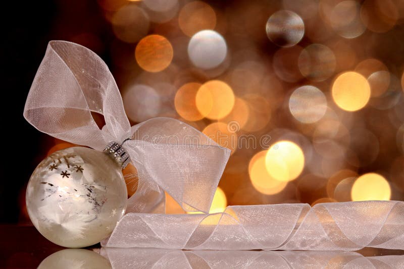 Christmas balls decorations closeup on a tablewith white fabric bow no people stock photo. Christmas balls decorations closeup on a tablewith white fabric bow no people stock photo