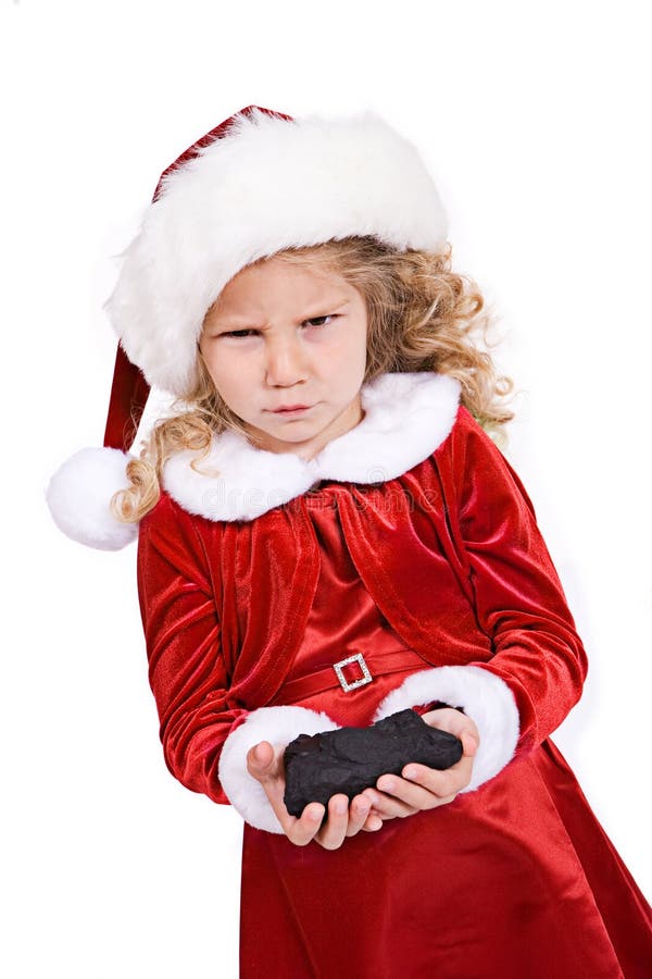 Natale: La ragazza ottiene il carbone da Santa For Bad Behavior immagini stock libere da diritti Natale: La ragazza ottiene il carbone da Santa For Bad Behavior immagini stock libere da diritti
