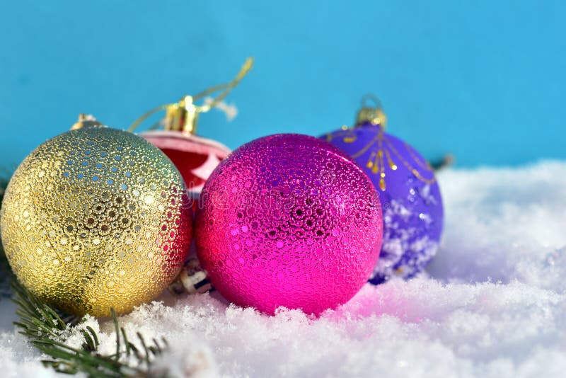 Christmas. On a snowdrift of white snow lie the decoration balls for the festive Christmas tree. Christmas. On a snowdrift of white snow lie the decoration balls for the festive Christmas tree.