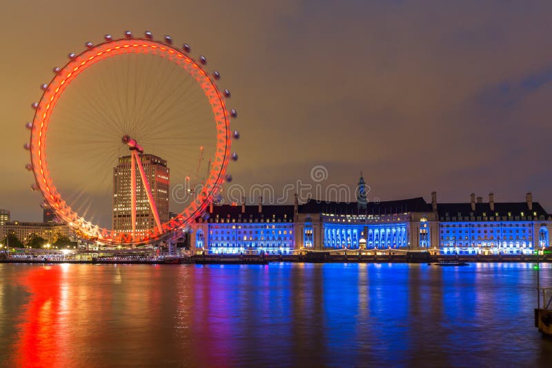 LONDON, ENGLAND - JUNE 16 2016: Night photo of The London Eye and County Hall from Westminster bridge, London, England, Great Britain. LONDON, ENGLAND - JUNE 16 2016: Night photo of The London Eye and County Hall from Westminster bridge, London, England, Great Britain