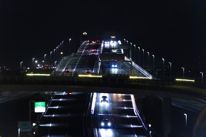 A night traffic jam on the highway at Tokyo bay area telephoto shot. High quality photo. Kisarazu district Chiba Japan 01.30.2024 Here is the highway parking called UMIHOTARU PA in Chiba Japan. A night traffic jam on the highway at Tokyo bay area telephoto shot. High quality photo. Kisarazu district Chiba Japan 01.30.2024 Here is the highway parking called UMIHOTARU PA in Chiba Japan.