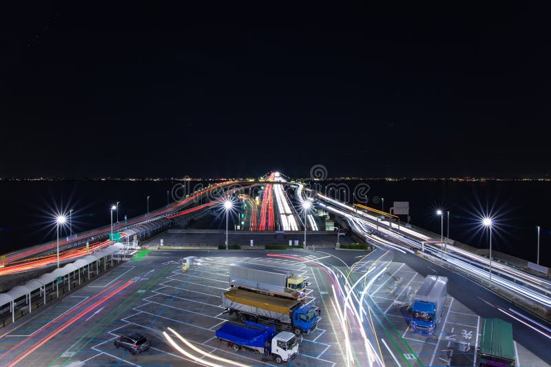 A night traffic jam on the highway at Tokyo bay area wide shot. High quality photo. Kisarazu district Chiba Japan 01.30.2024 Here is the highway parking called UMIHOTARU PA in Chiba Japan. A night traffic jam on the highway at Tokyo bay area wide shot. High quality photo. Kisarazu district Chiba Japan 01.30.2024 Here is the highway parking called UMIHOTARU PA in Chiba Japan.