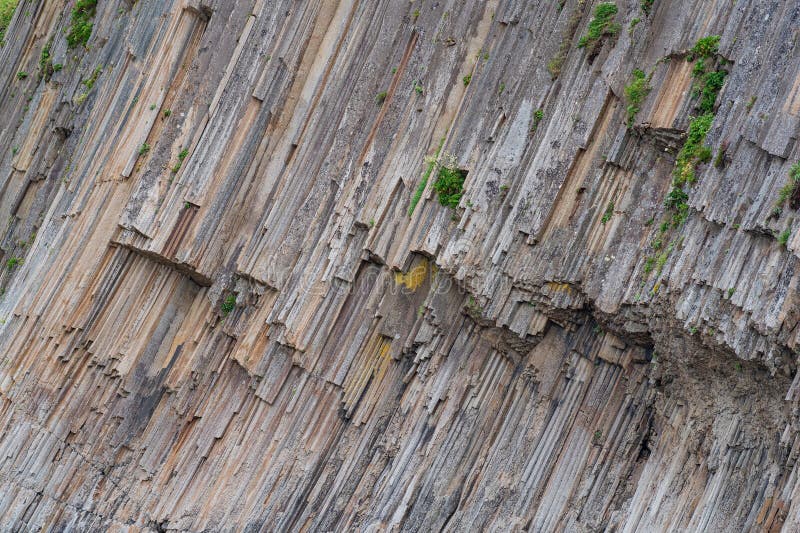 Natural background, rock fragment from volcanic lava columns stock photo