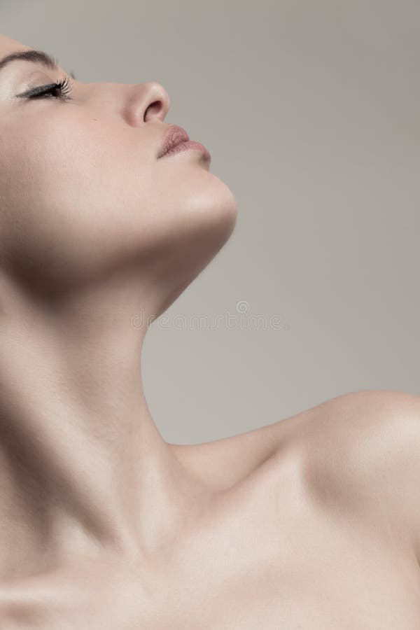 Natural beauty concept young woman  profile  face and neck studio shot stock photo