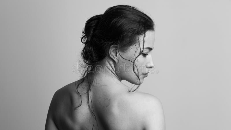 Natural beauty concept young woman with wet hair in bun profile and back studio shot stock photos