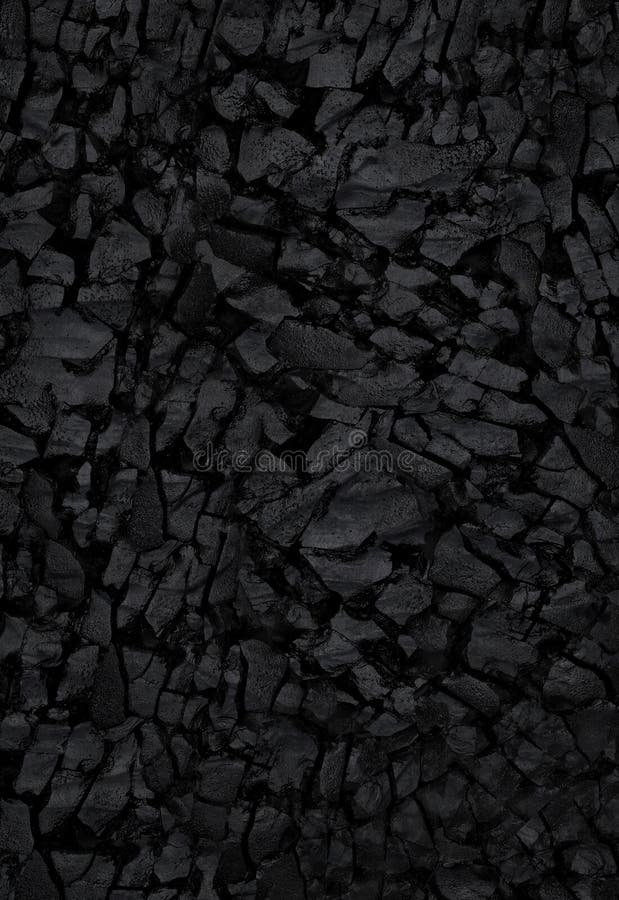 Natural black activated charcoal texture for backgrounds. Top view royalty free stock image