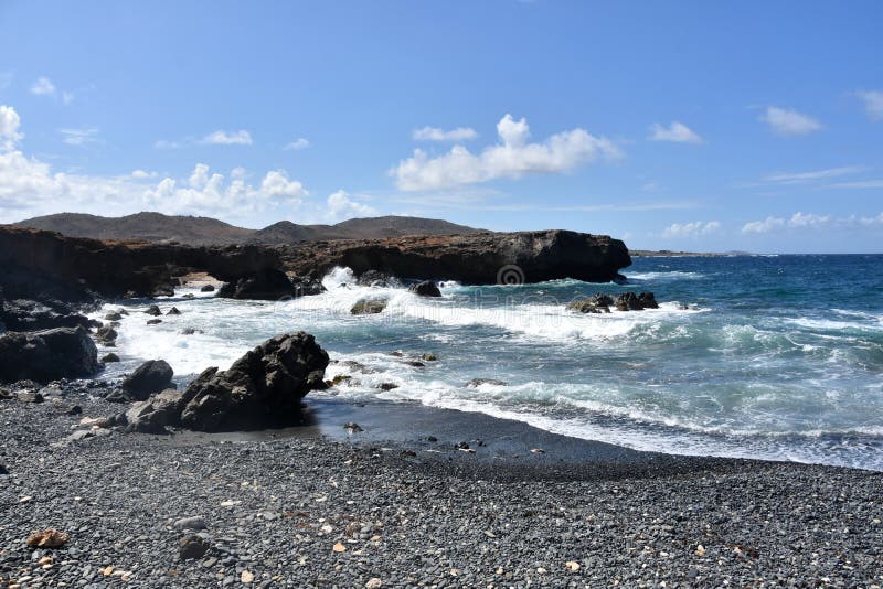 Natural Bridge On Black Stone Beach In Aruba Stock Photo Image Of