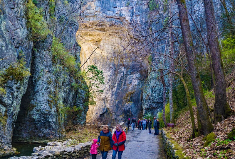 Natural Bridge State Park, Rockbridge County, VA, January 1st: A large group of visitors walking under Natural Bridge arch January 1st, 2020, Natural Bridge State Park, Rockbridge County, Virginia, USA. Natural Bridge State Park, Rockbridge County, VA, January 1st: A large group of visitors walking under Natural Bridge arch January 1st, 2020, Natural Bridge State Park, Rockbridge County, Virginia, USA