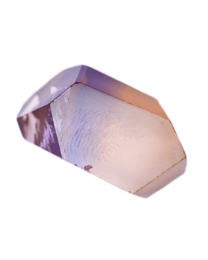 Natural cut ametrine gemstone from Bolivia, isolated on white background