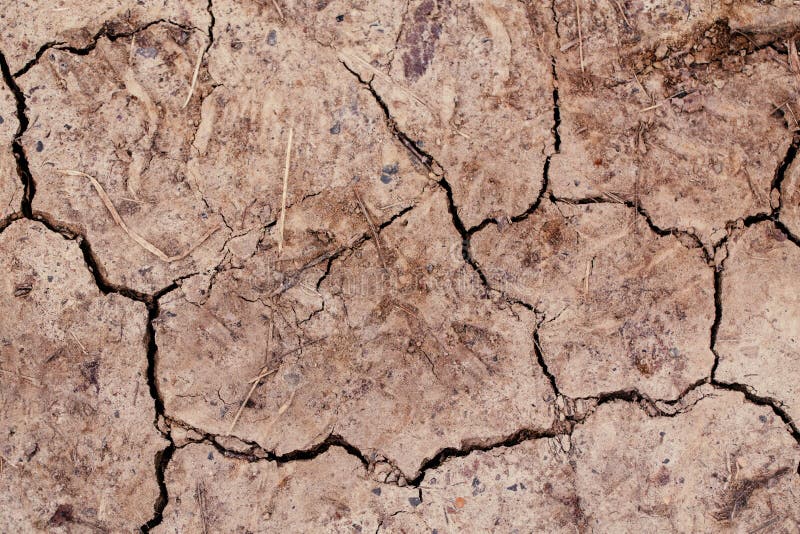 Natural dirty mud ground texture background. Closeup macro of dry brown soil sand land. Abstract earth nature backdrop, wallpaper stock images