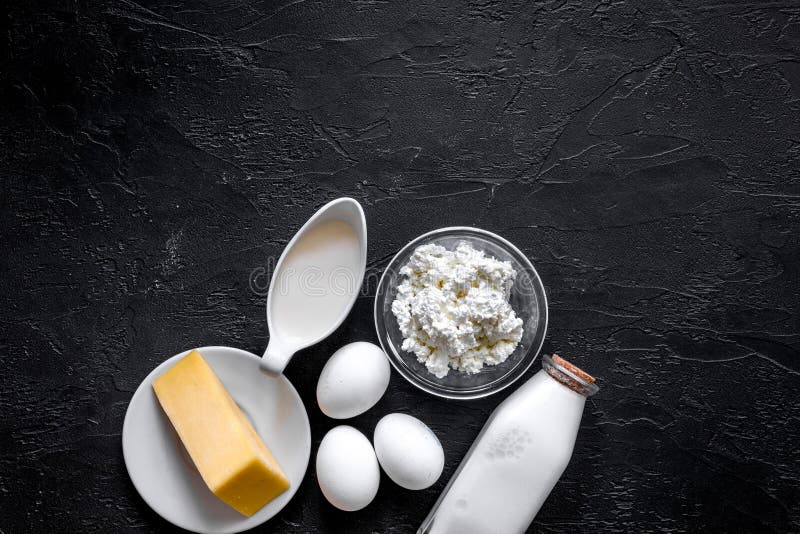 Natural food. Milk, cottage, cheese, eggs on black stone background top view copyspace stock images Natural food. Milk, cottage, cheese, eggs on black stone background top view copyspace stock images