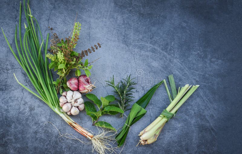 Natural fresh herbs and spice on black plate in the kitchen for ingredient food - kitchen herb garden concept stock photography Natural fresh herbs and spice on black plate in the kitchen for ingredient food - kitchen herb garden concept stock photography