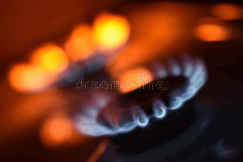 Natural Gas Burning a Blue Flames on Black Background Stock Image