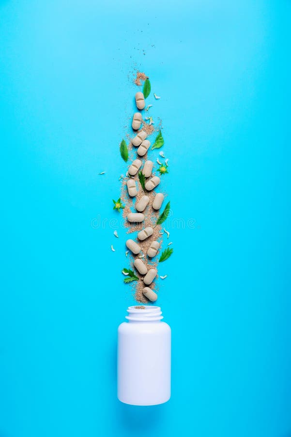 Natural herbal additives from herbs, poured from a white jar. The concept of healthy eating. Detox stock images Natural herbal additives from herbs, poured from a white jar. The concept of healthy eating. Detox stock images