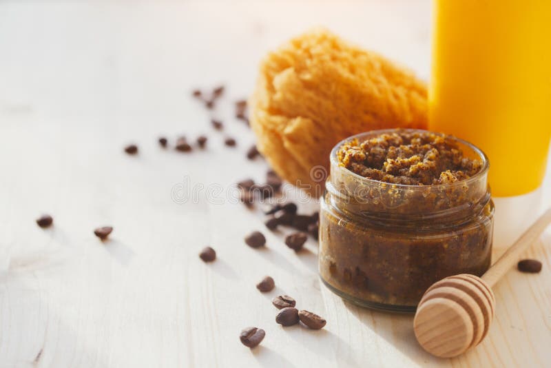 Natural honey scrub made of salt or sugar, coffee and coconut oil, shampoo or lotion bottle, sea sponge and wooden dipper