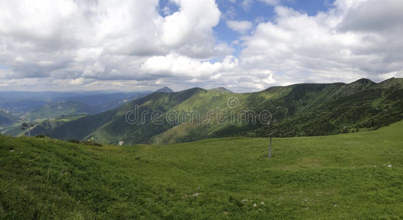 Natural landscape in the foothills of the High Tatras in the north of Slovakia in early summer with wide valleys and green meadows