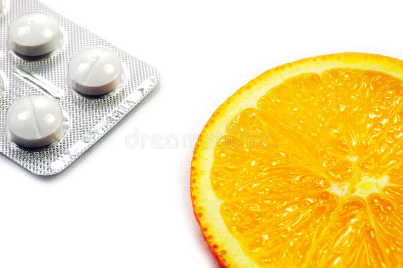 Natural orange fruit vs chemical medicine royalty free stock photo