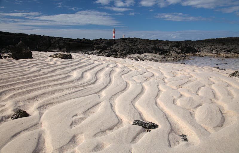 Natural sand pattern created by a flow of tide and ripples