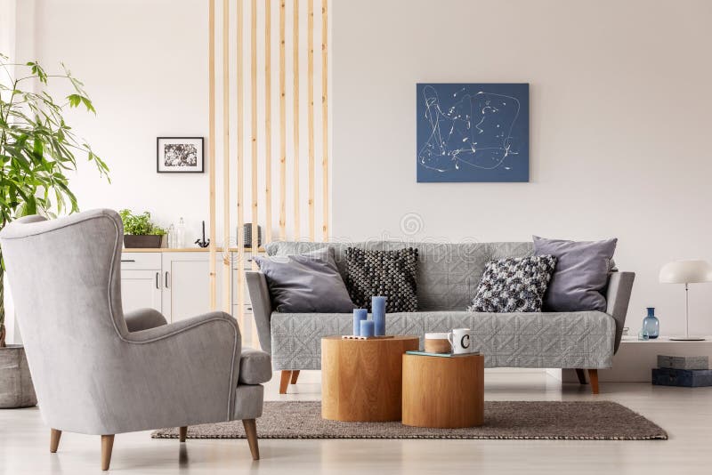 Natural scandinavian living room interior with wooden furniture, mockup picture on empty white wall stock image Natural scandinavian living room interior with wooden furniture, mockup picture on empty white wall stock image