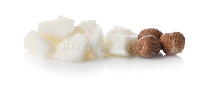 Natural shea butter and nuts isolated on white royalty free stock photography