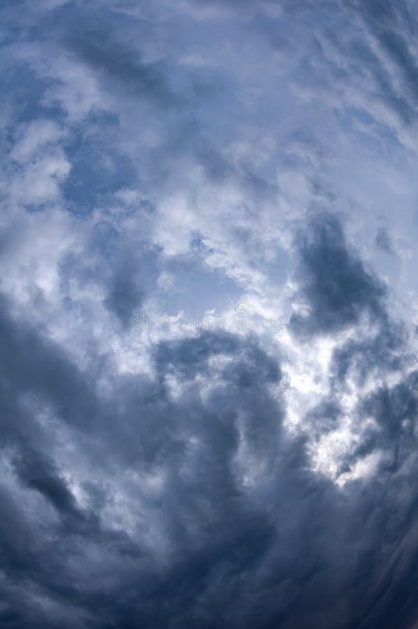 Natural sky composition. Dark ominous grey storm rain clouds. Dramatic sky. Overcast stormy cloudscape. Thunderstorm