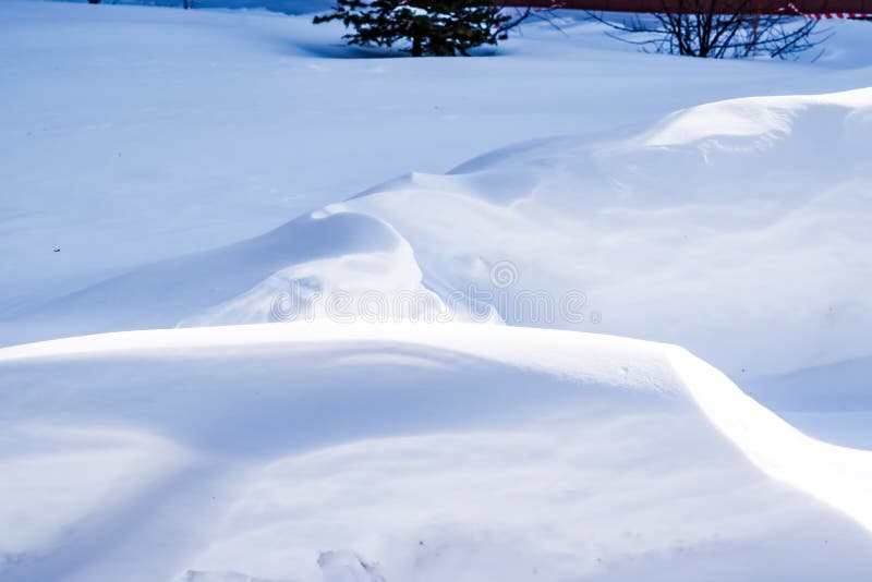 Natural winter snow surface texture with natural patterns, winter background