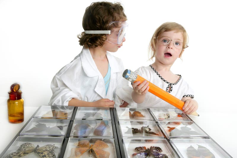 Naturalist little girls playing with big pencil and butterfly collection. Naturalist little girls playing with big pencil and butterfly collection