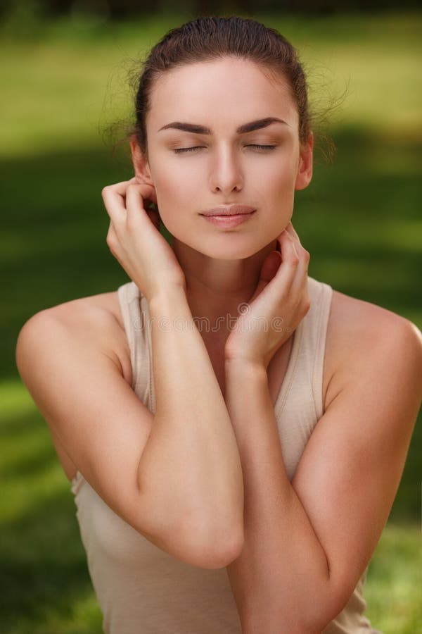 Natural peaceful portrait of a beautiful girl with pure skin relax outdoors, nature and purity. Natural peaceful portrait of a beautiful girl with pure skin relax outdoors, nature and purity