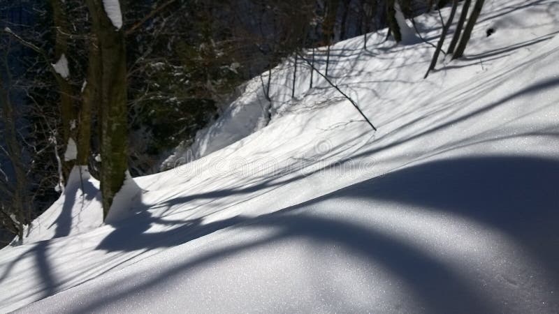 Nature covered in the snow during cold Winter in the country on the hills.