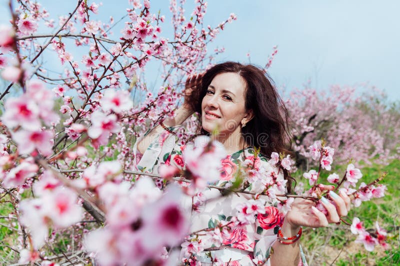 Nature Park Spring Woman Stands in a Garden of Flowering Pink Trees ...
