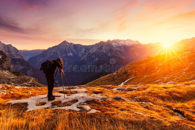 Nature photographer taking photos in the mountains