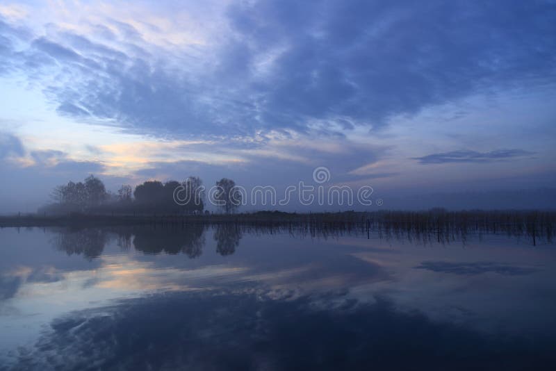 Nature early morning sunrise blue sky and clouds gelderland