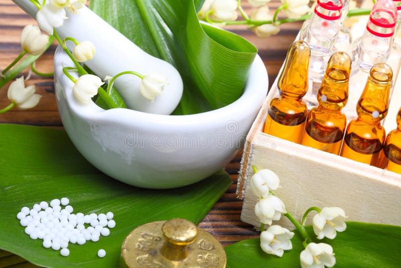 Naturopathy, ampules with medicine from lily of the valley. Green herbal drug medicine stock images, royalty-free photos and pictures