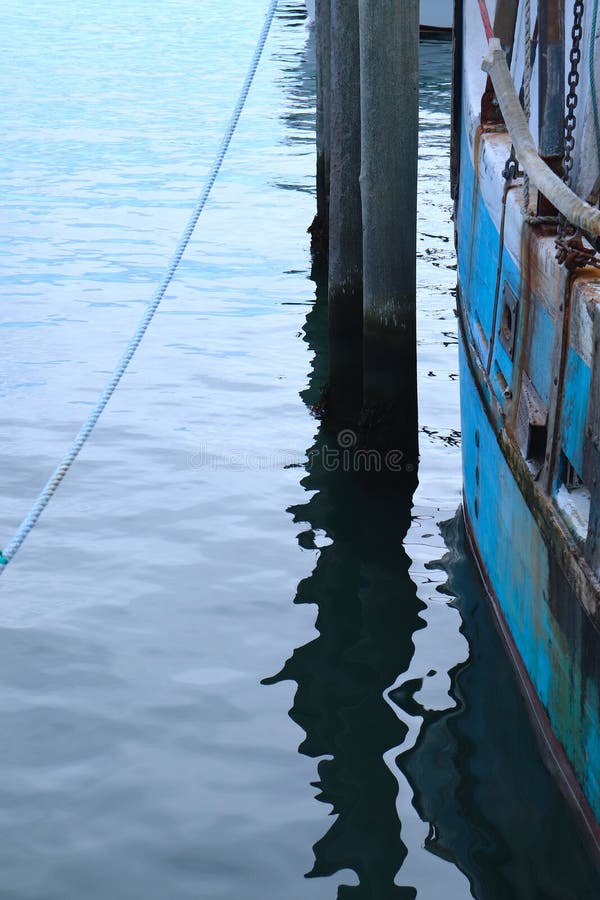 Nautical Abstract of Dock, with Rope, Water, Pier, Blue Boat