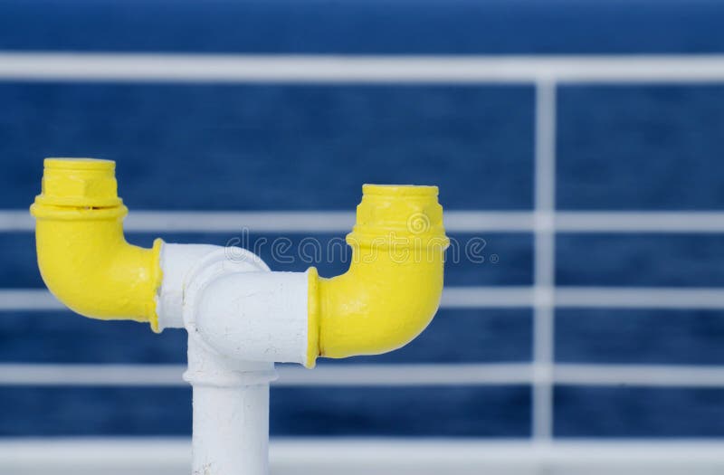 Nautical equipment of the ferry boat deck - yellow pipe stock image