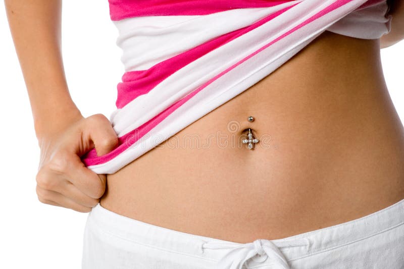 A woman shows off her belly button piercing. A woman shows off her belly button piercing