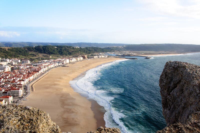 Nazare beach in Portugal stock photo. Image of holiday 39373438