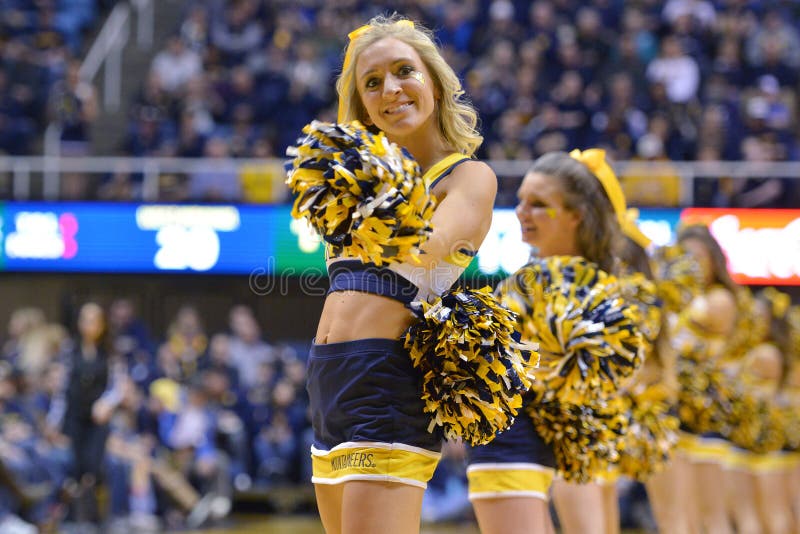 MORGANTOWN, WV - MARCH 7: The West Virginia cheerleaders perform during the...