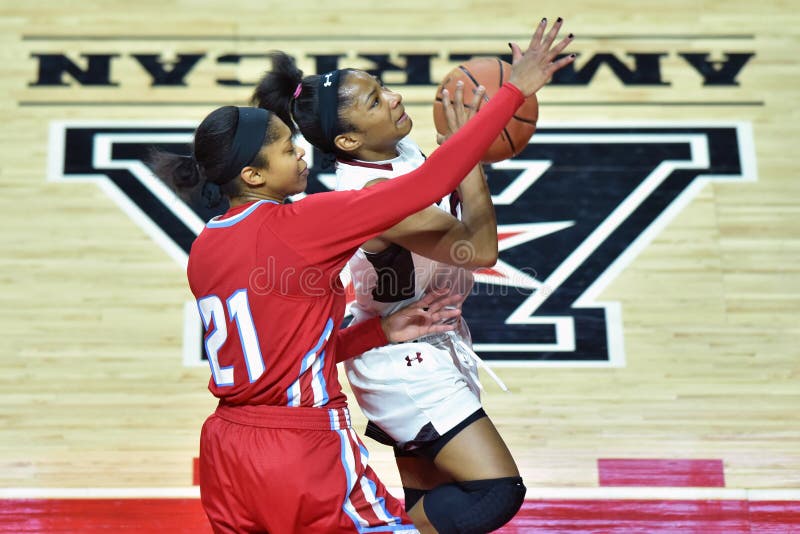 Temple Owls guard ALLIYA BUTTS (0) drives past Delaware State Hornets guard ALIAH STINNETT (21) during the NCAA women's basketball game played at the Liacouras Center in Philadelphia. Temple Owls guard ALLIYA BUTTS (0) drives past Delaware State Hornets guard ALIAH STINNETT (21) during the NCAA women's basketball game played at the Liacouras Center in Philadelphia.